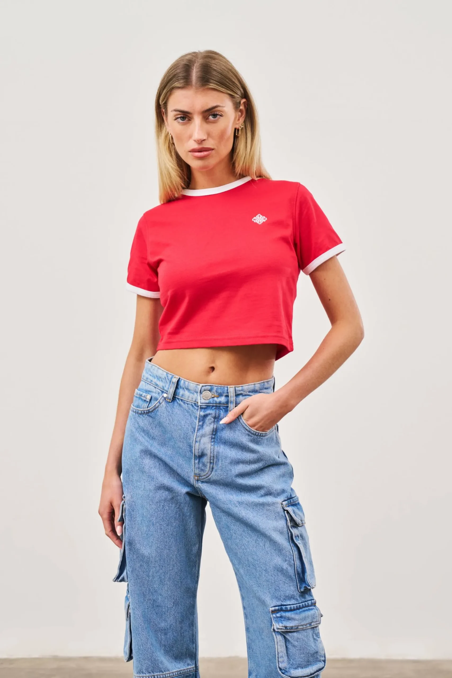 couture_emblem_ringer_bab_1-1.webp The Couture Club Couture Emblem Ringer Baby Tee