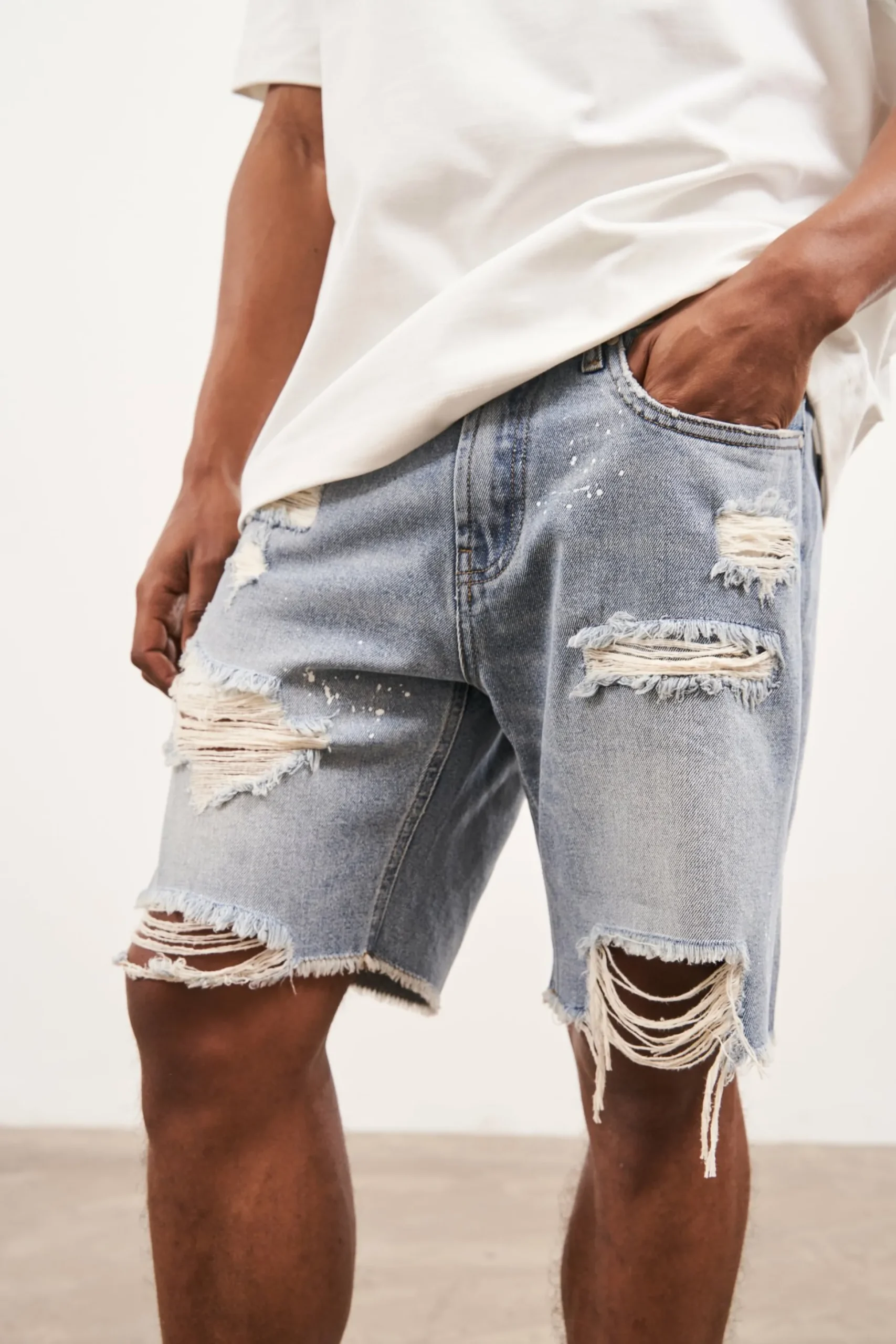 distressed_raw_hem_denim__4-1.webp The Couture Club Distressed Raw Hem Denim Shorts